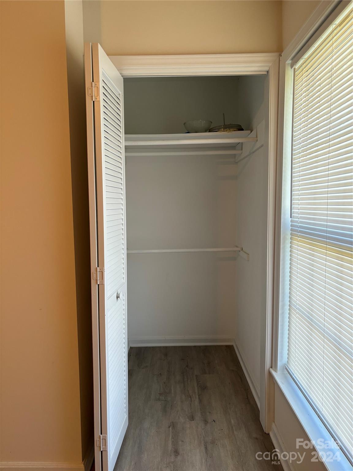 2145 East Holly Grove Road Lexington, NC 27292 - Photo 15 of 19 a view of walk in closet with empty racks