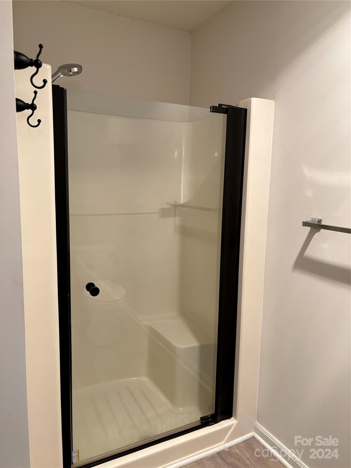 2145 East Holly Grove Road Lexington, NC 27292 - Photo 17 of 19 a bathroom with a glass shower door