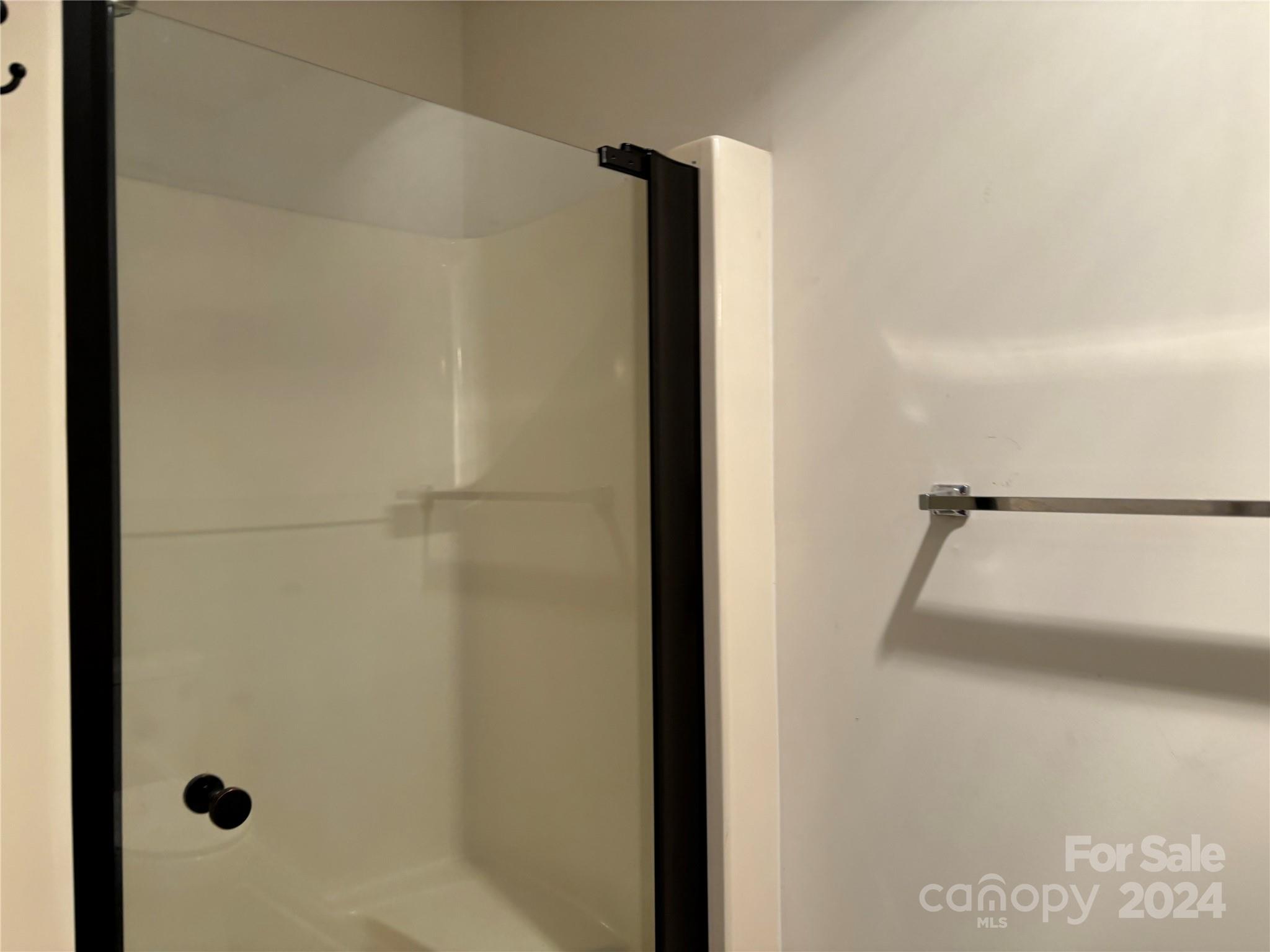 2145 East Holly Grove Road Lexington, NC 27292 - Photo 18 of 19 a bathroom with a glass shower door