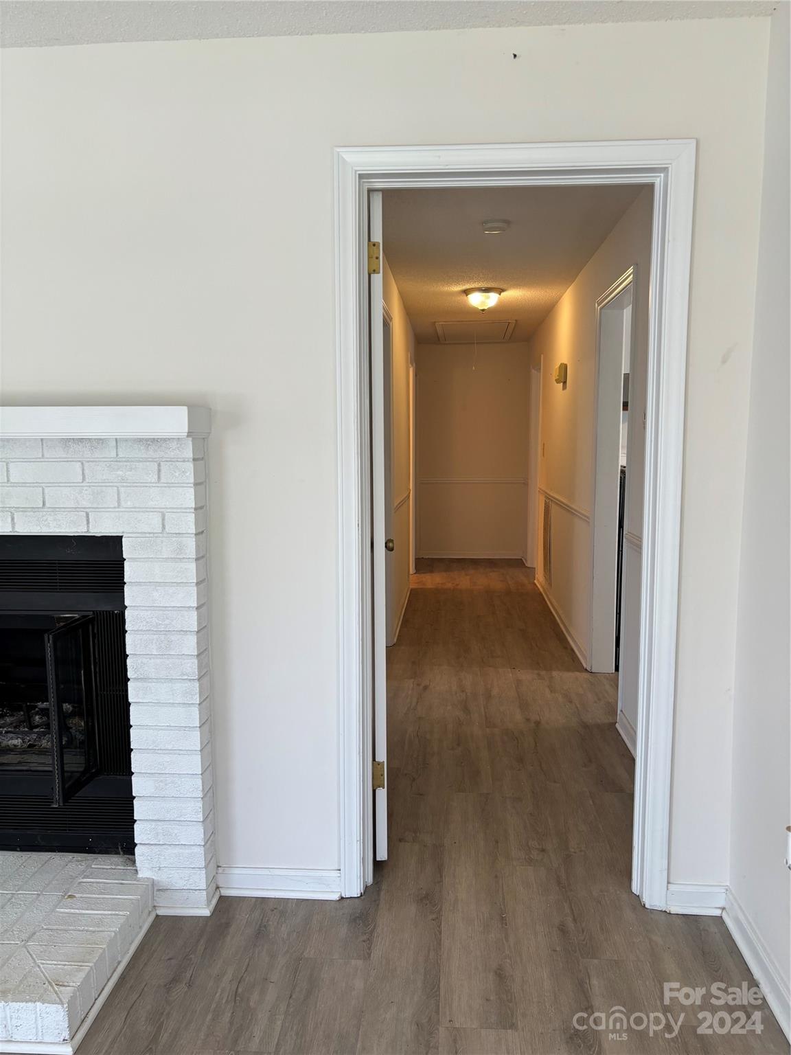 2145 East Holly Grove Road Lexington, NC 27292 - Photo 6 of 19 a view of a hallway with wooden floor and staircase