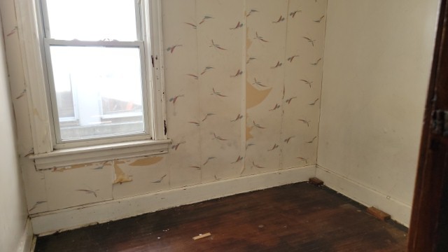 5751 South Carpenter Street Chicago, IL 60621 - Photo 5 of 10 an empty room with a window