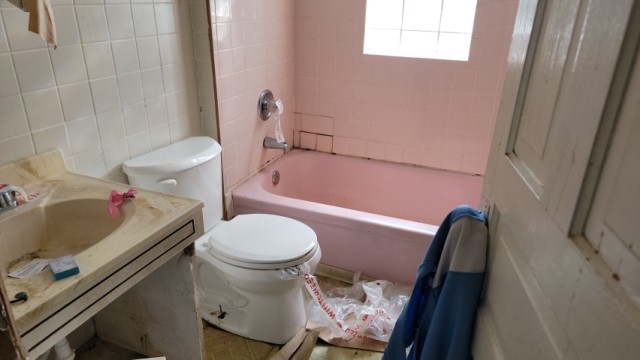 5751 South Carpenter Street Chicago, IL 60621 - Photo 8 of 10 a bathroom with a sink and a toilet
