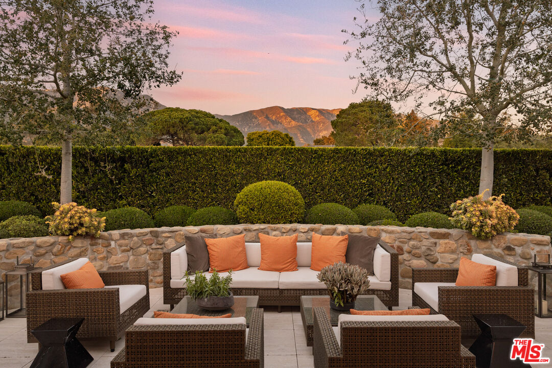 2076 China Flat Road Santa Barbara, CA 93108 - Photo 14 of 27 a roof deck with couches and wooden floor