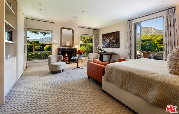 a bedroom with a balcony a bed and a couch