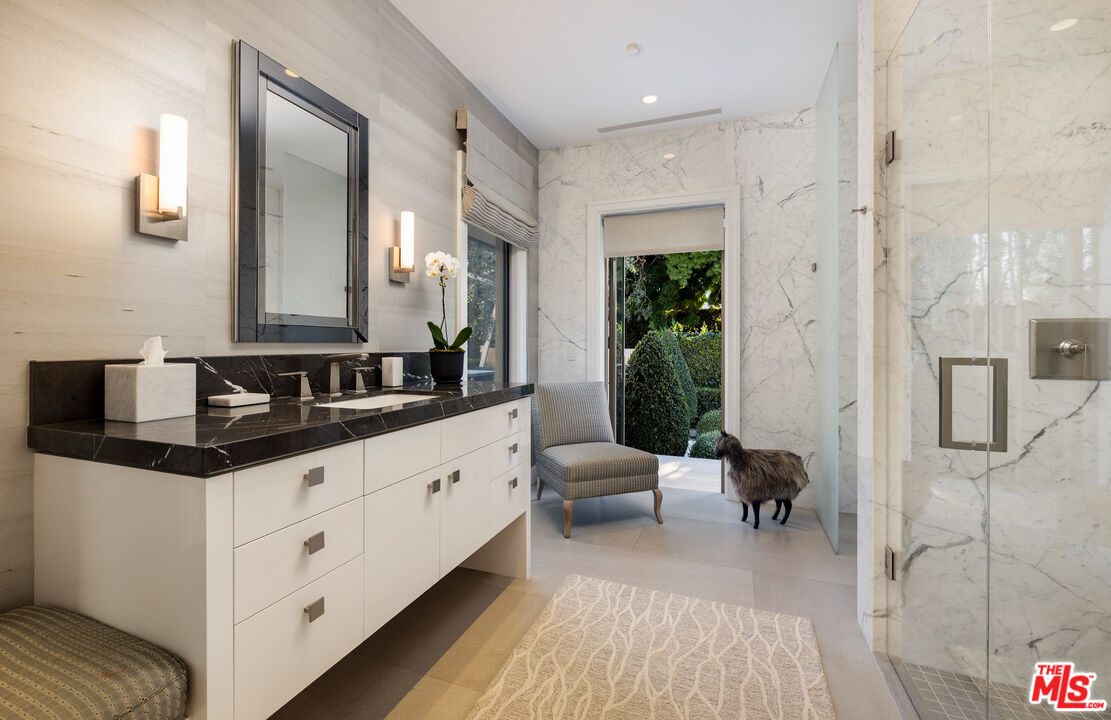 2076 China Flat Road Santa Barbara, CA 93108 - Photo 18 of 27 a spacious en suite bathroom with a double vanity sink and a mirror