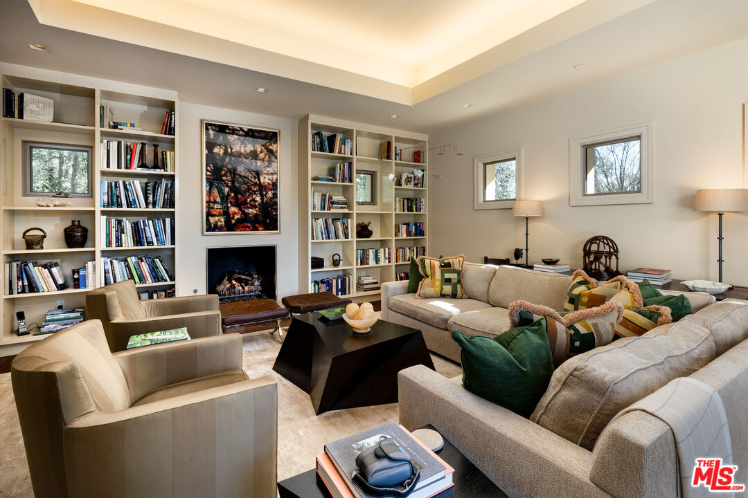 2076 China Flat Road Santa Barbara, CA 93108 - Photo 22 of 27 a living room with furniture and a book shelf