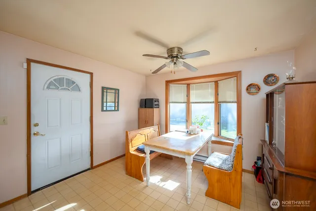 a view of a livingroom with furniture and a window
