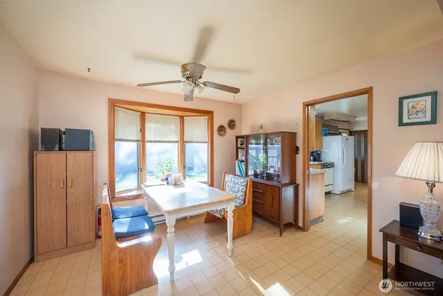 a living room with furniture and large window