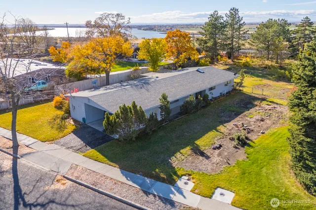 an aerial view of a house with a swimming pool
