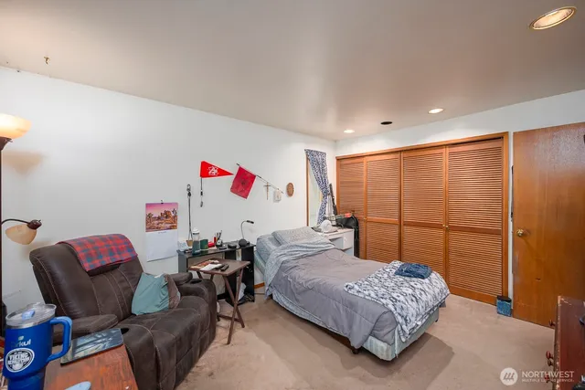 a room with a bed and furniture