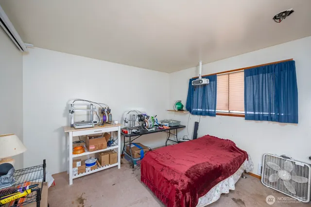 a bedroom with a bed and a closet