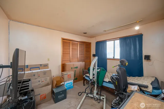 a bed room with furniture and a window