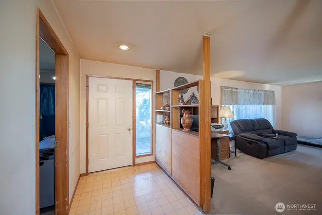 a view of a livingroom with furniture and cabinet
