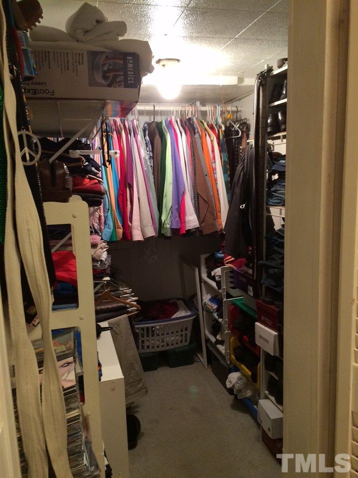 3101 Brentwood Road Raleigh, NC 27604 - Photo 14 of 17 a view of walk in closet with clothes and shoes