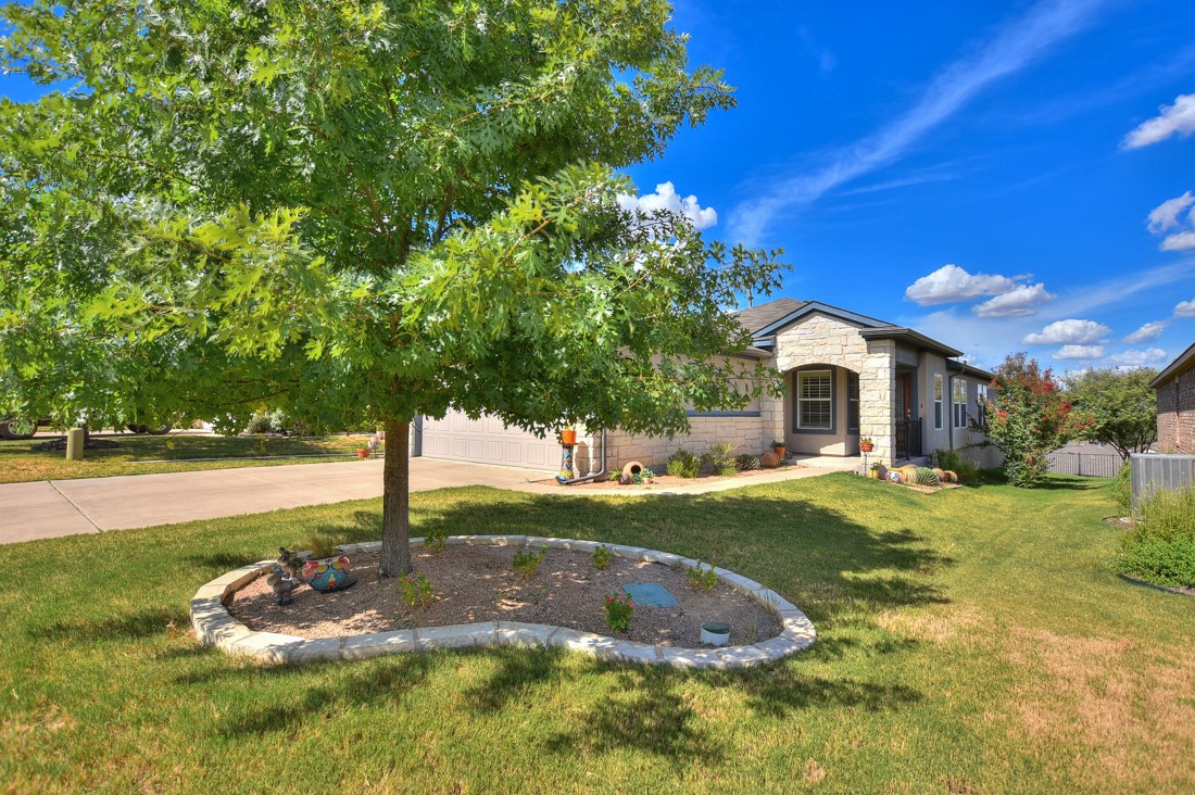 106 Kickapoo Creek Lane Georgetown, TX 78633 - Photo 2 of 33 a front view of a house with garden