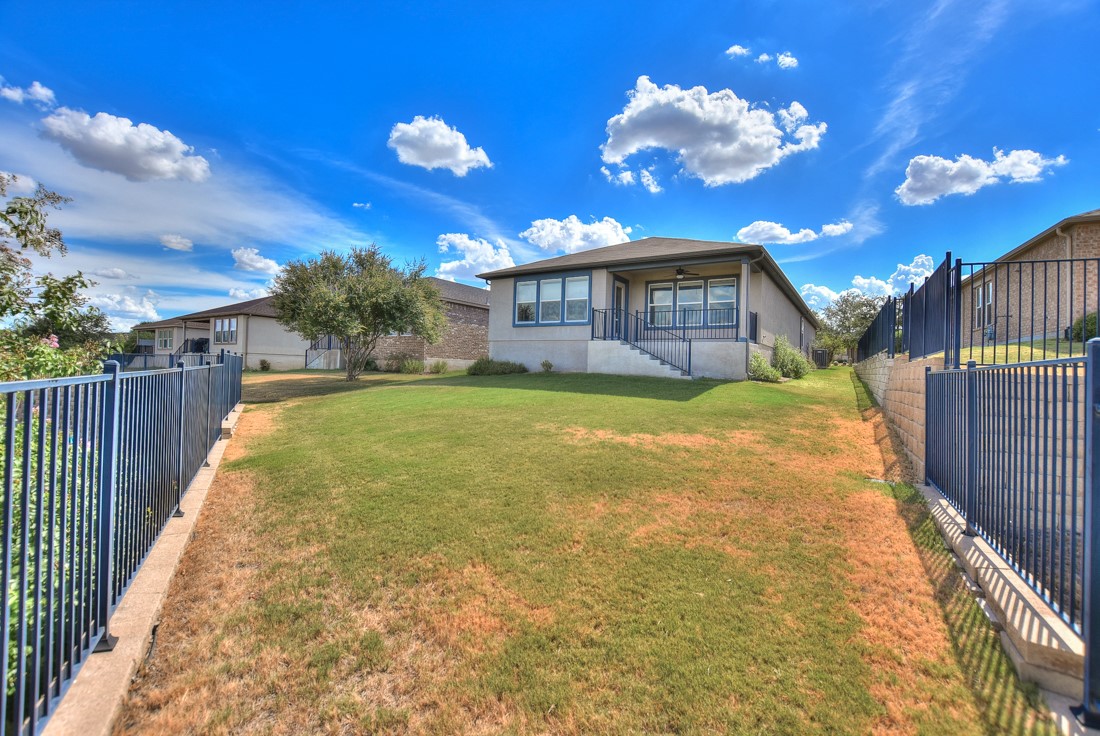 106 Kickapoo Creek Lane Georgetown, TX 78633 - Photo 32 of 33 a view of a house with a yard
