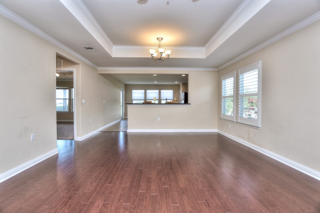 106 Kickapoo Creek Lane Georgetown, TX 78633 - Photo 10 of 33 wooden floor in an empty room with a window