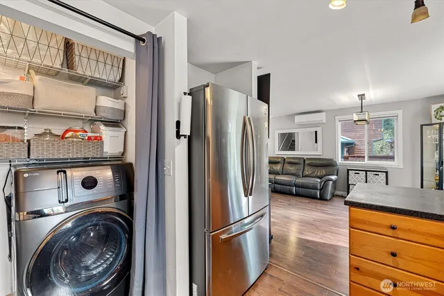 a kitchen with stainless steel appliances granite countertop a refrigerator and a sink