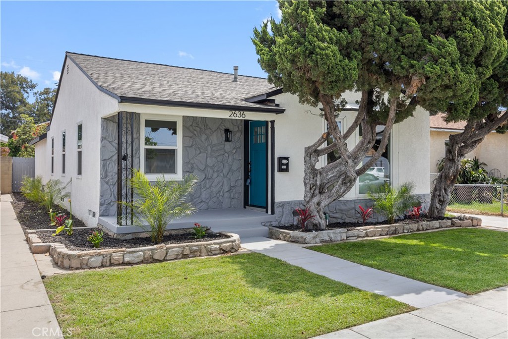 2636 Delta Avenue Long Beach, CA 90810 - Photo 1 of 2 a front view of a house with garden