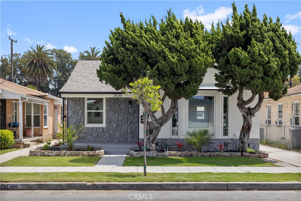 2636 Delta Avenue Long Beach, CA 90810 - Photo 2 of 2 a front view of a house with a yard