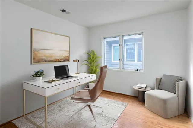 a workspace with furniture and window