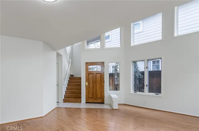 a view of an entryway with wooden floor and stairs