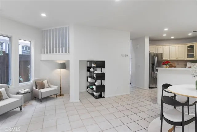 a living room with furniture and white doors
