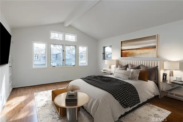 a bedroom with bed and a window