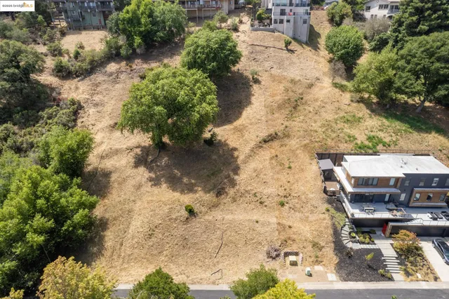 a balcony with dining table and chairs