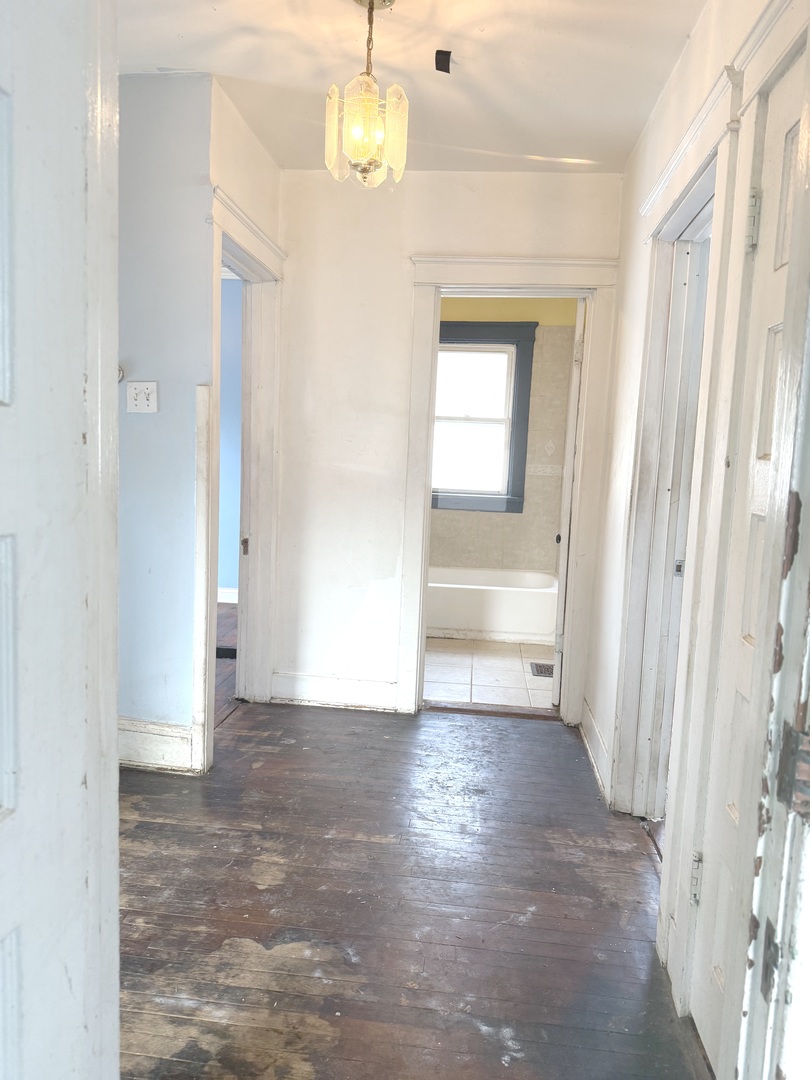 10228 South Prospect Avenue Chicago, IL 60643 - Photo 12 of 23 a view of a hallway with wooden floor and cabinet