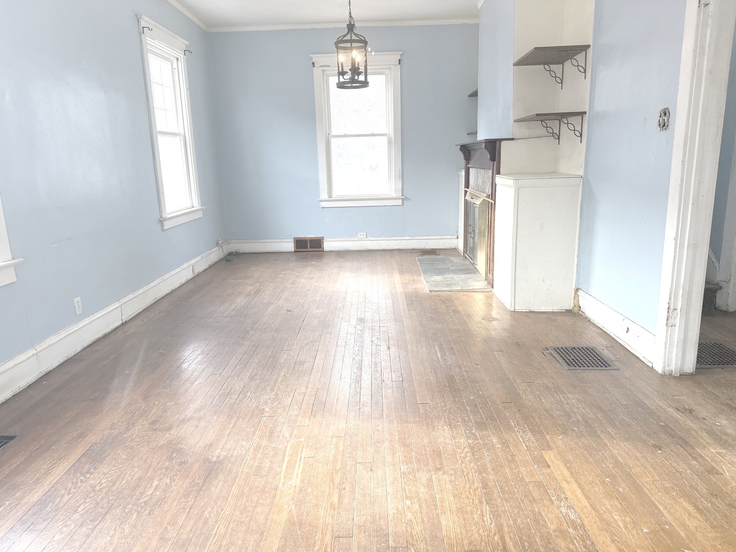 10228 South Prospect Avenue Chicago, IL 60643 - Photo 3 of 23 a view of empty room with wooden floor and fan