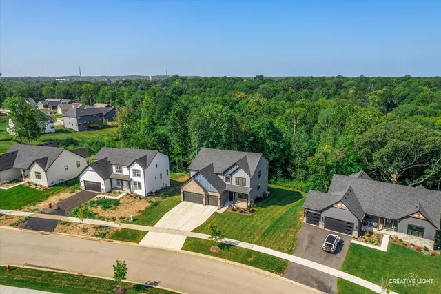 an aerial view of a house having yard