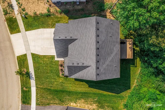 an aerial view of a house with a garden