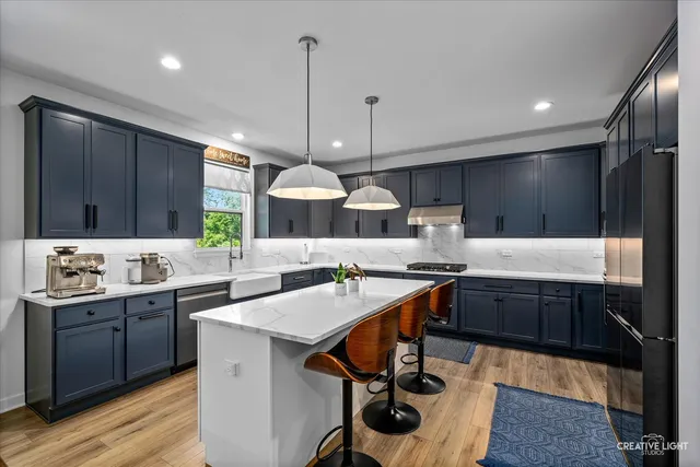 a kitchen with lots of counter top space and appliances