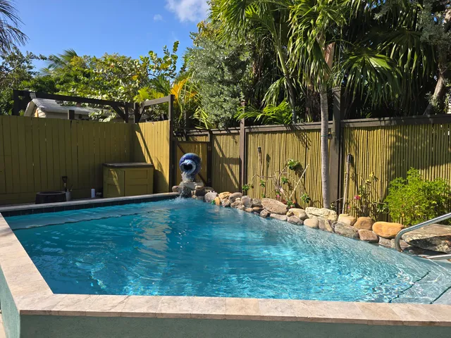 a view of swimming pool with a yard