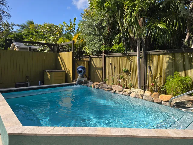 a group of people sitting in a kitchen