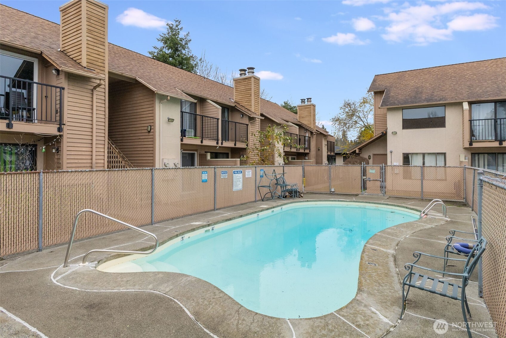 12434 Ambaum Boulevard Southwest, Unit 114 Burien, WA 98146 - Photo 17 of 18 a view of a house with backyard