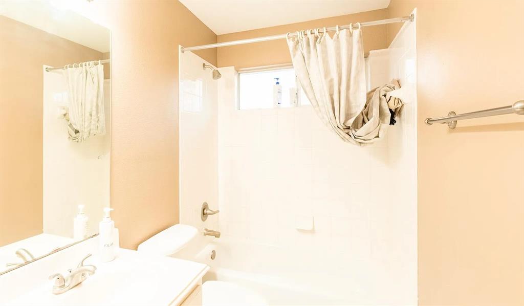 3829 Walnut Ridge Lane Plano, TX 75074 - Photo 14 of 18 a bathroom with a bathtub and a shower