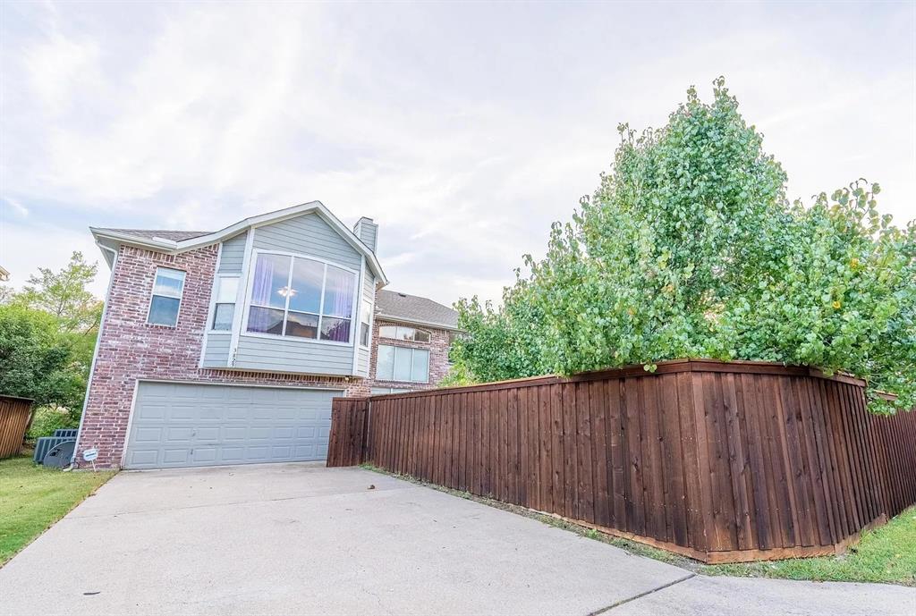 3829 Walnut Ridge Lane Plano, TX 75074 - Photo 18 of 18 front view of a house with a fence