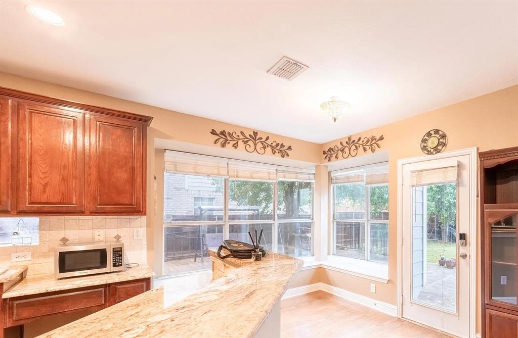 3829 Walnut Ridge Lane Plano, TX 75074 - Photo 3 of 18 a very nice looking room with a large window