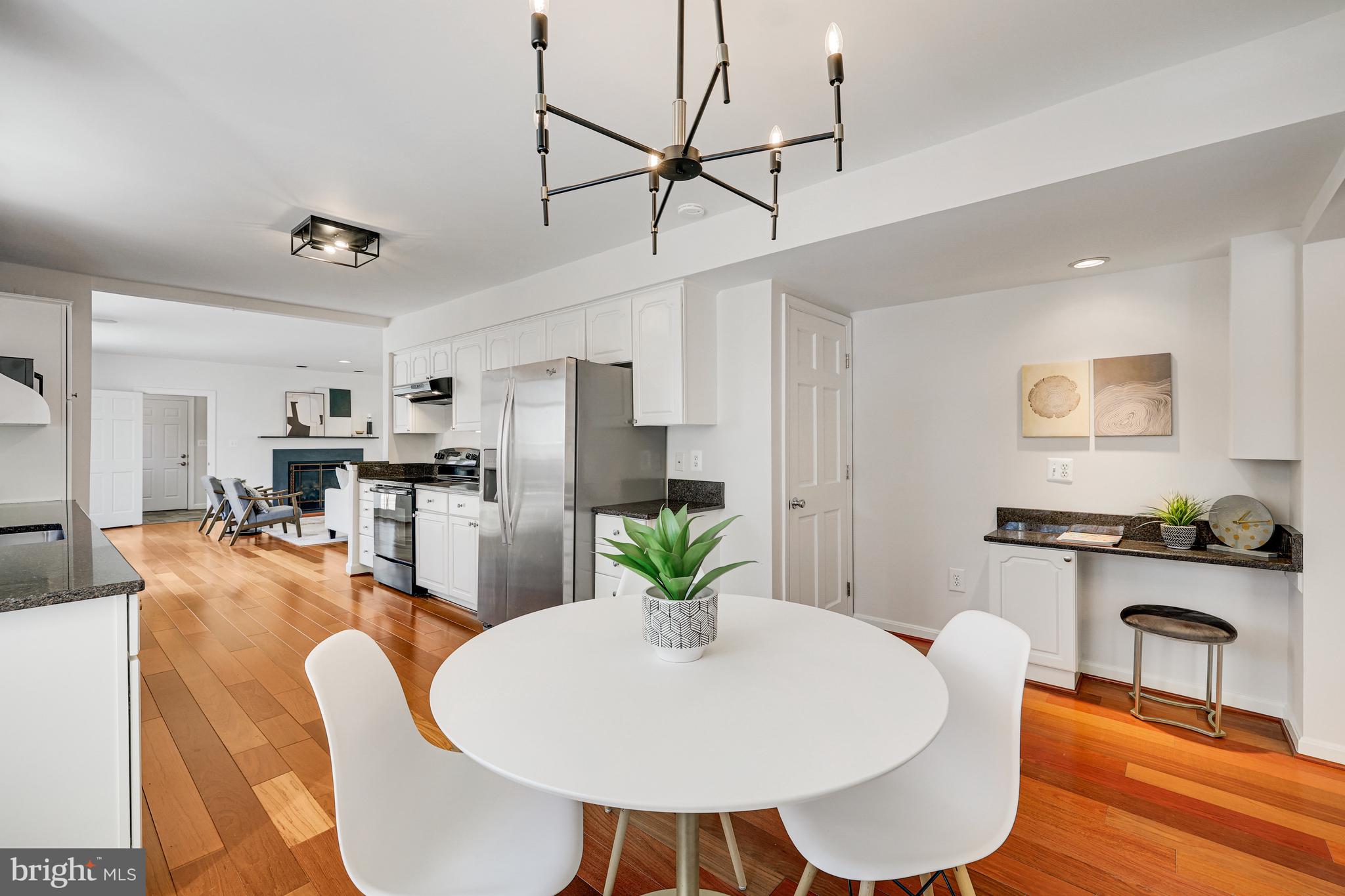 1807 Post Oak Trail Reston, VA 20191 - Photo 20 of 79 a living room with stainless steel appliances furniture a dining table and chairs