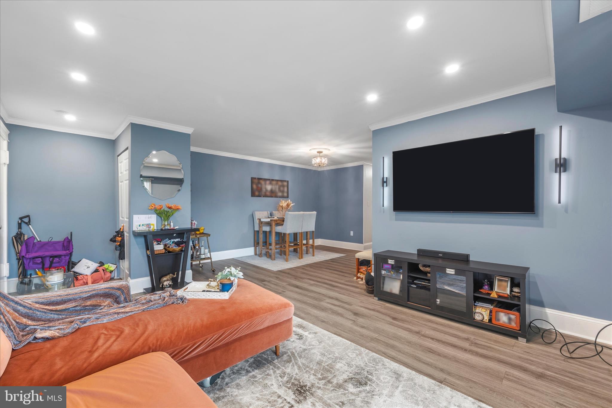 11334 Cherry Hill Road, Unit 2J20 Beltsville, MD 20705 - Photo 12 of 39 a living room with furniture and a flat screen tv