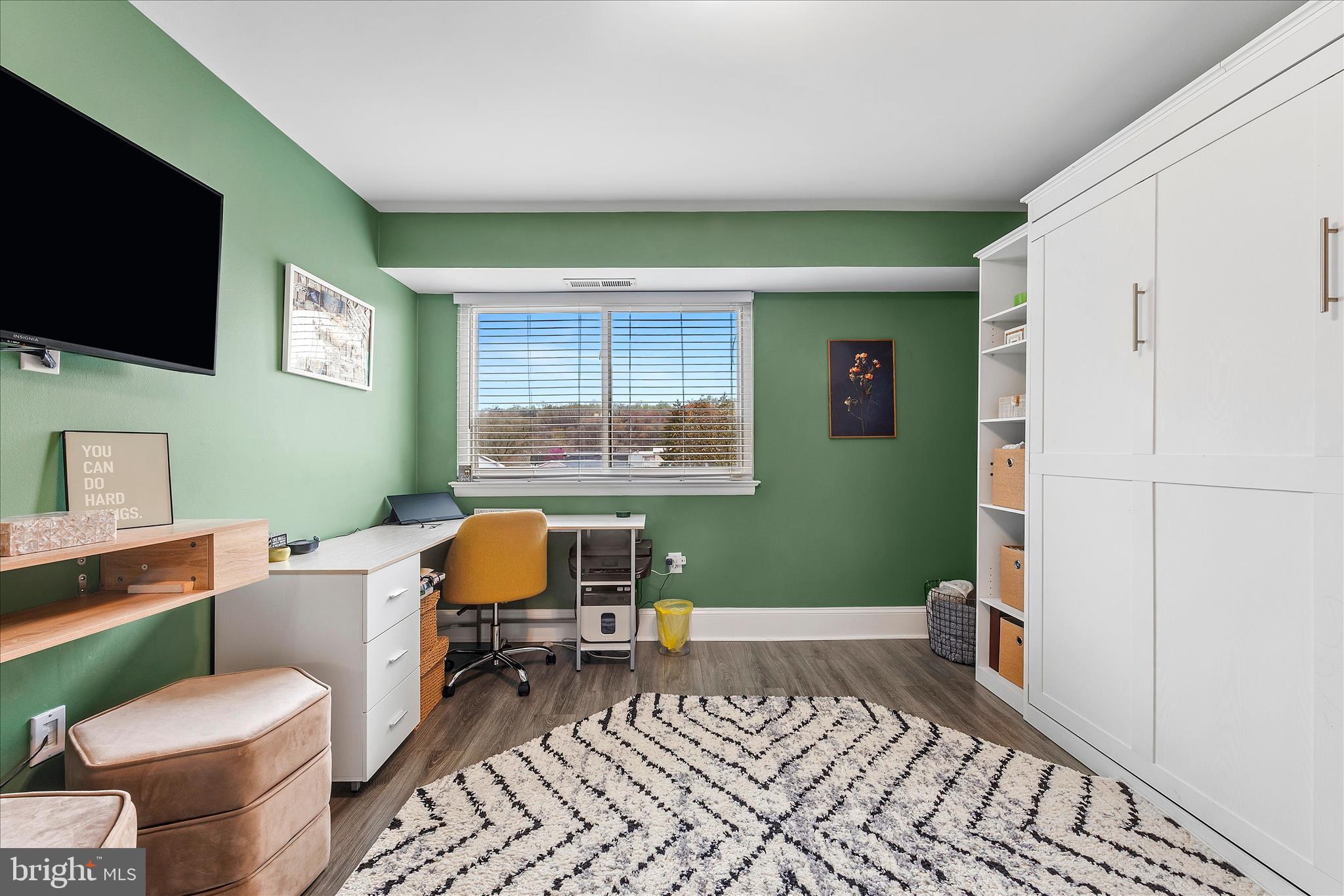 11334 Cherry Hill Road, Unit 2J20 Beltsville, MD 20705 - Photo 20 of 39 a bedroom with a bed and a flat screen tv