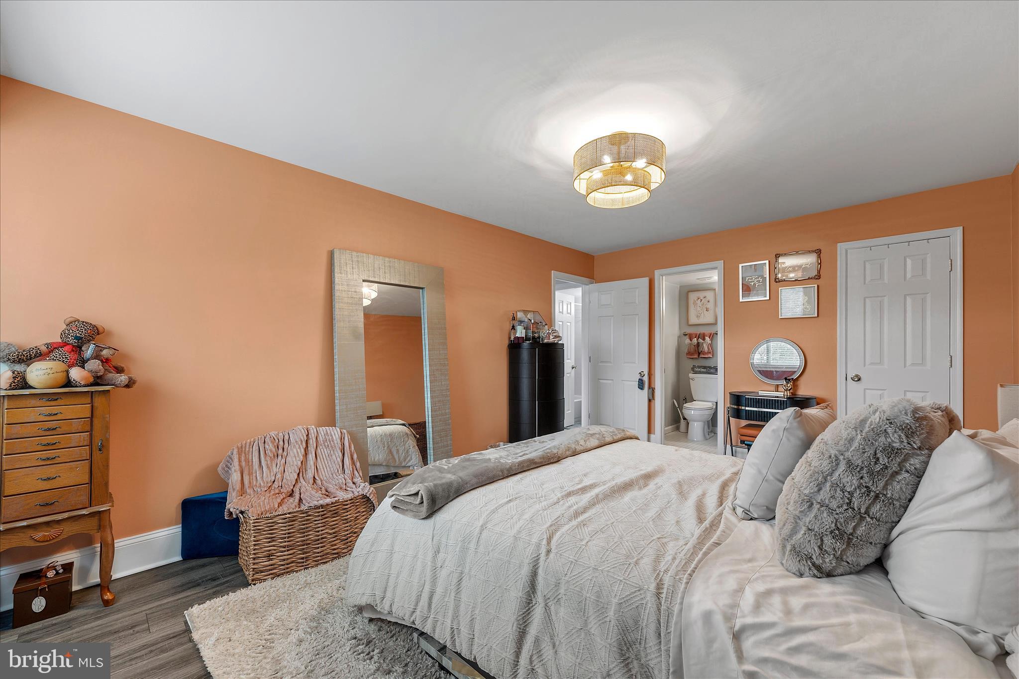 11334 Cherry Hill Road, Unit 2J20 Beltsville, MD 20705 - Photo 22 of 39 a bedroom with a bed and wooden floor