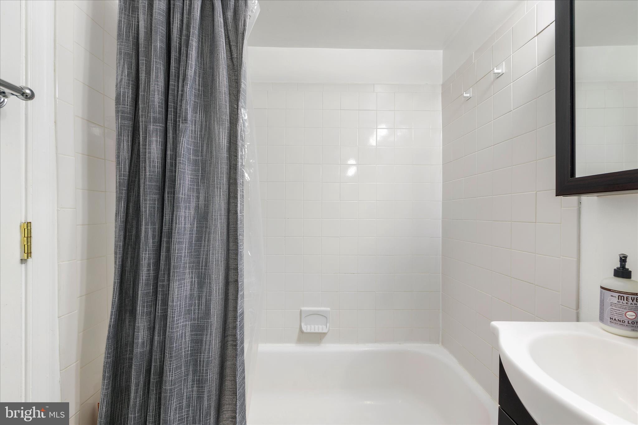 11334 Cherry Hill Road, Unit 2J20 Beltsville, MD 20705 - Photo 24 of 39 a bathroom with a bathtub