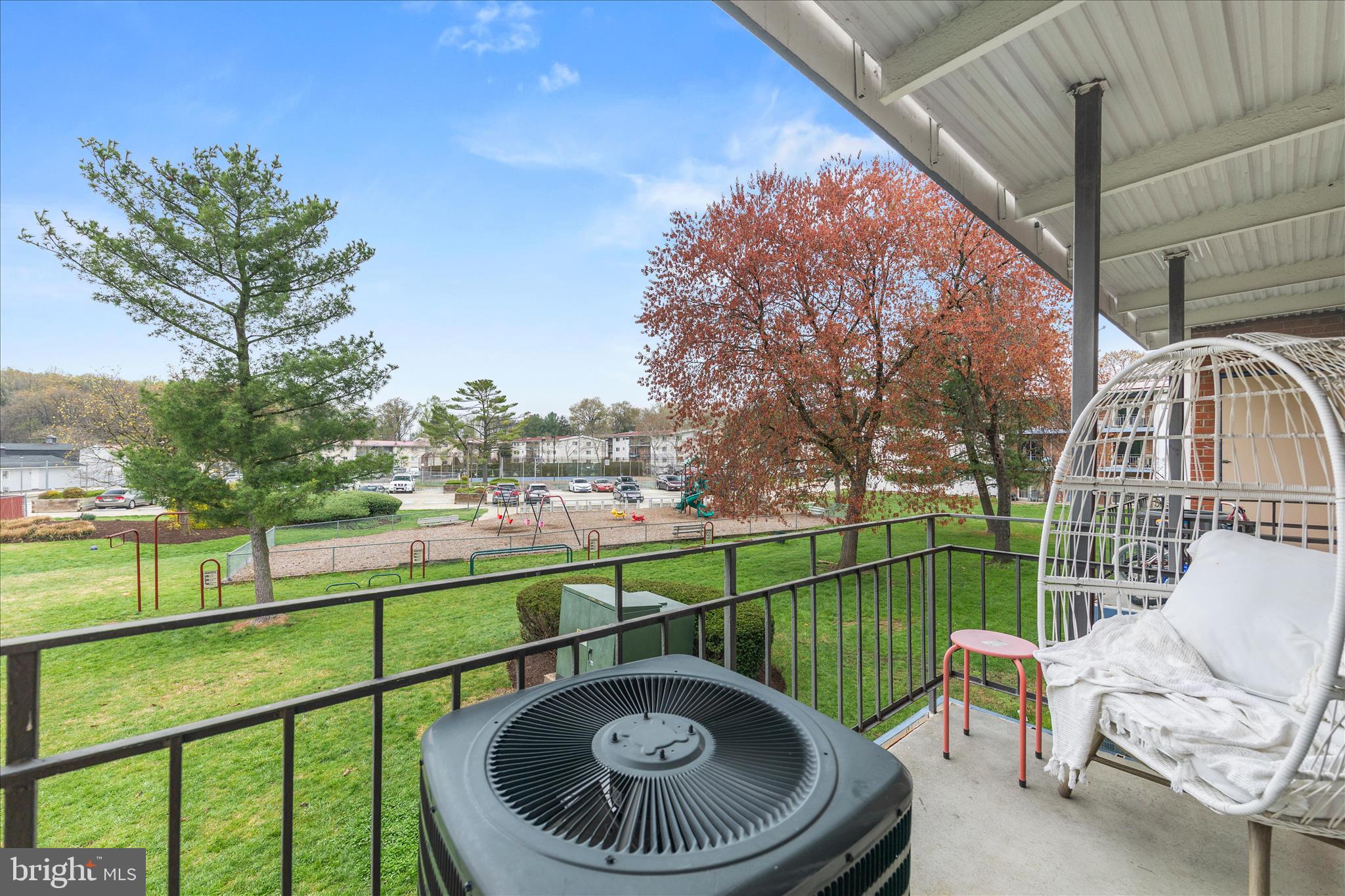 11334 Cherry Hill Road, Unit 2J20 Beltsville, MD 20705 - Photo 26 of 39 a view of a chair and tables in the balcony