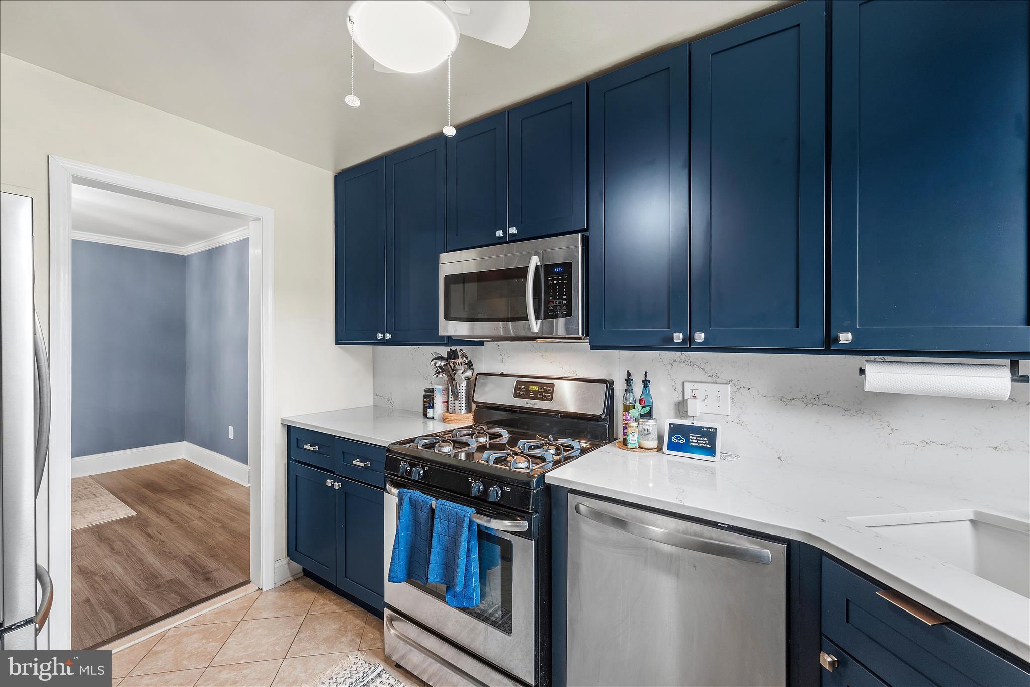 11334 Cherry Hill Road, Unit 2J20 Beltsville, MD 20705 - Photo 6 of 39 a kitchen with a sink a stove and cabinets