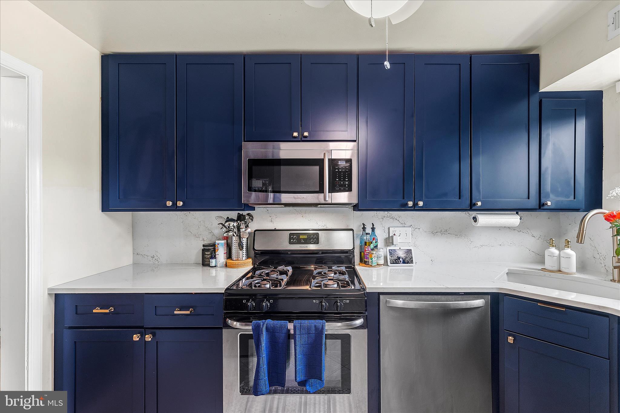 11334 Cherry Hill Road, Unit 2J20 Beltsville, MD 20705 - Photo 7 of 39 a kitchen with a sink a stove and cabinets