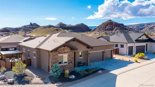 a view of a house with patio outdoor seating