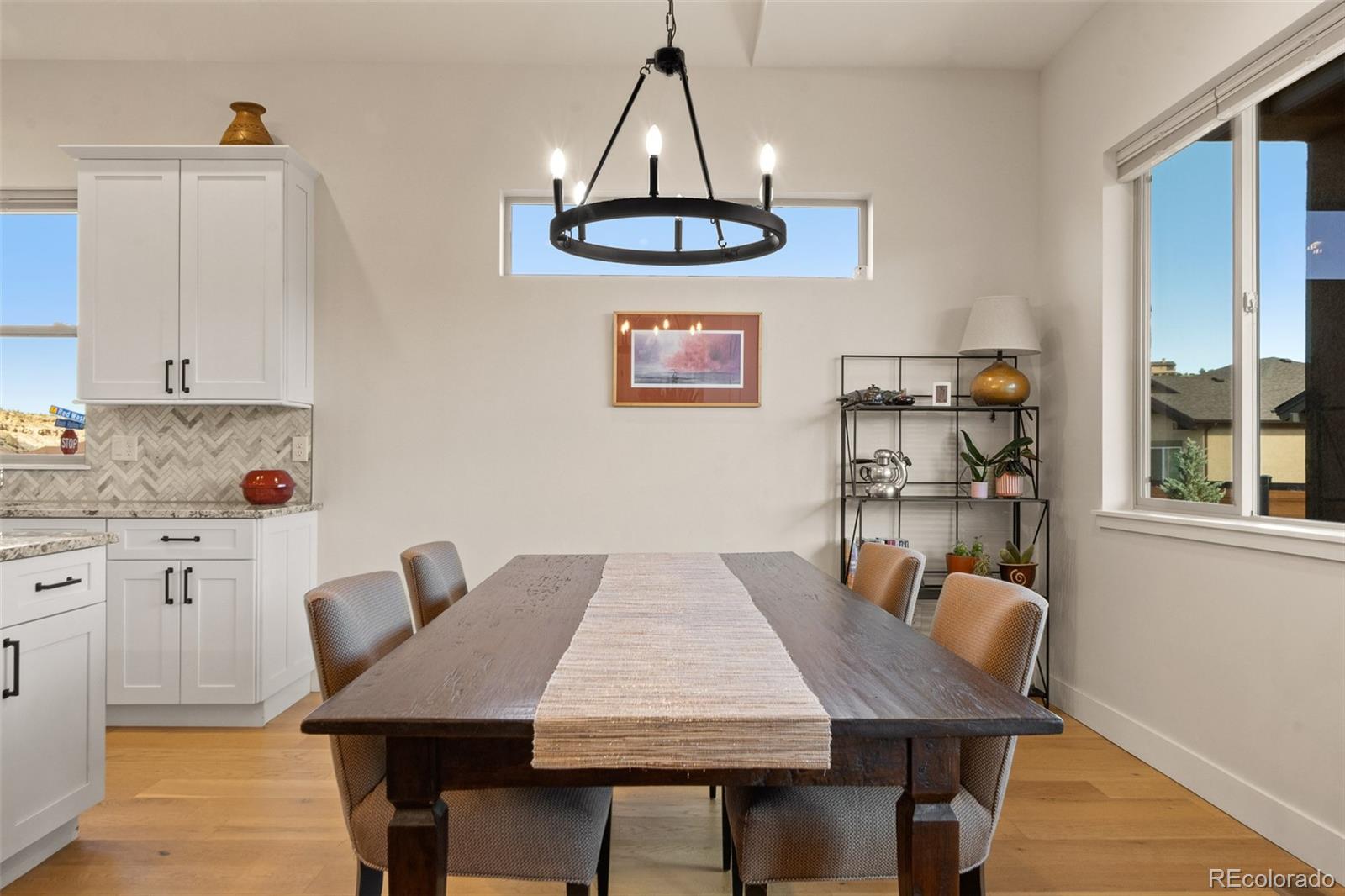 2287 Rock Valley Road Grand Junction, CO 81507 - Photo 12 of 32 a view of a dining room with furniture and wooden floor